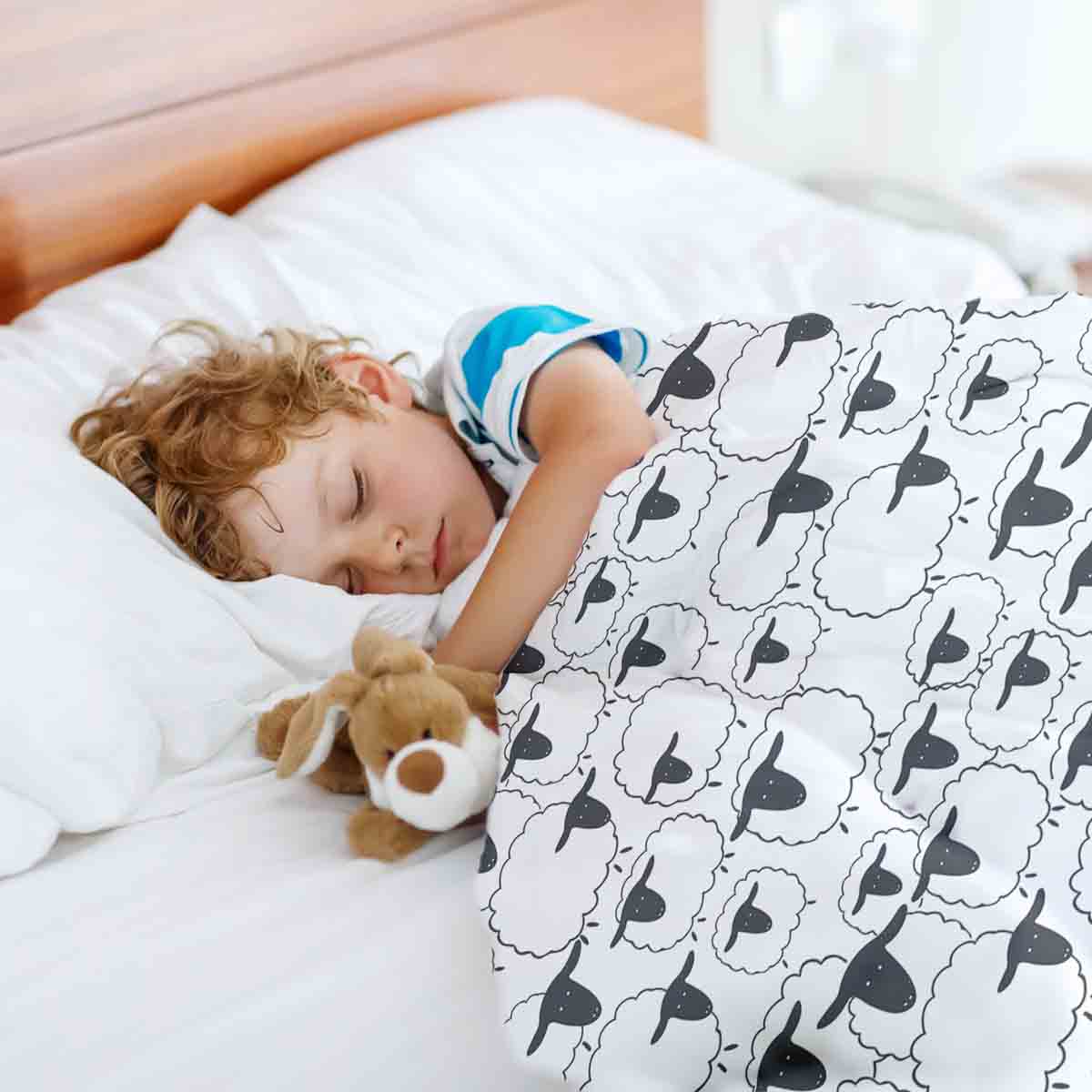 Ensemble de literie avec couverture thérapeutique blanche avec moutons