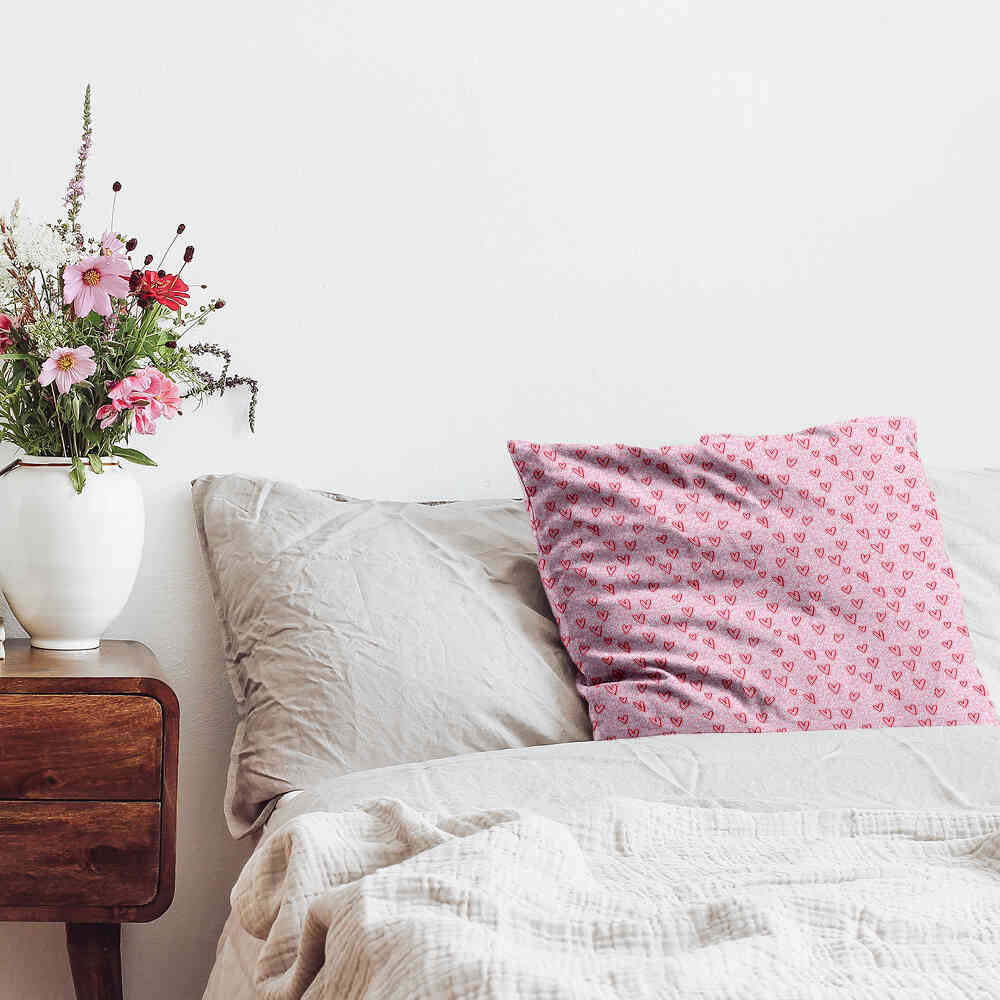 Coussin de santé rose avec des cœurs rouges
